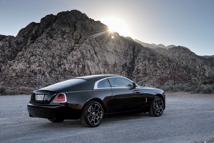 Black Rolls-Royce Wraith in a rocky landscape