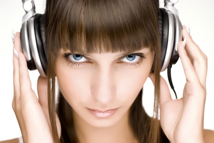 Woman with blue eyes wearing headphones