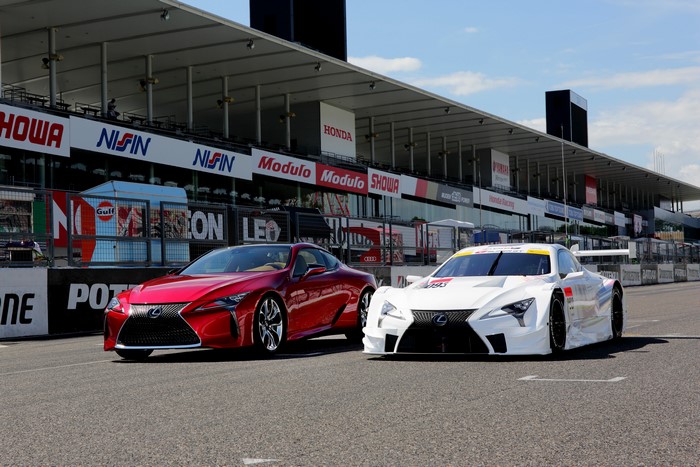 Two Lexus LC 500 Super GT cars on a racetrack