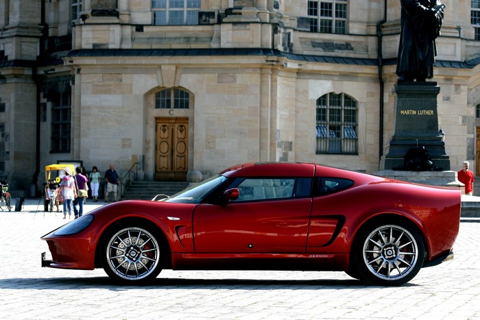 Red Melkus RS2000 GT006 parked in front of a building
