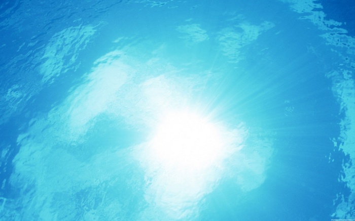 Sunlight shining through blue water