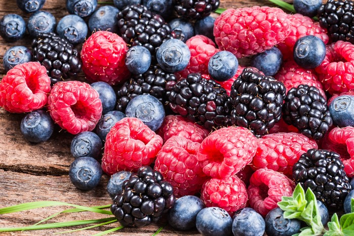 Raspberries, Blackberries, and Blueberries on Wood