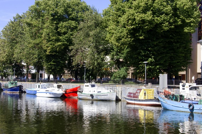 Boats docked in a canal in Klaipeda, Lithuania