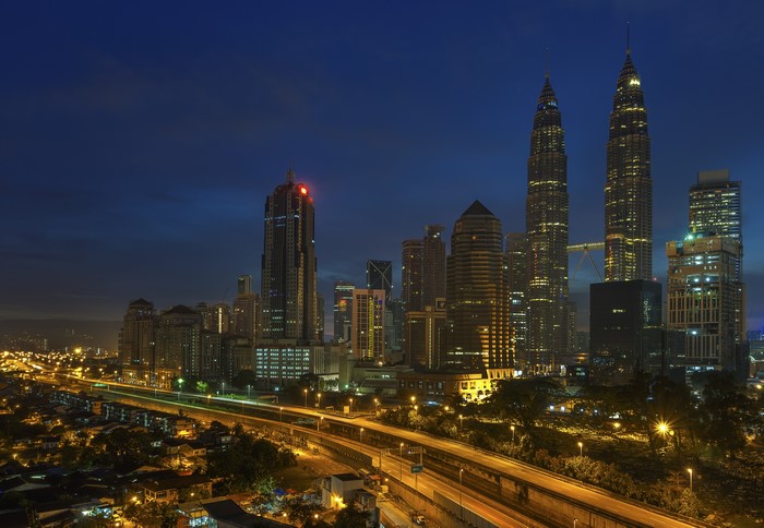 Kuala Lumpur skyscrapers and roads at night