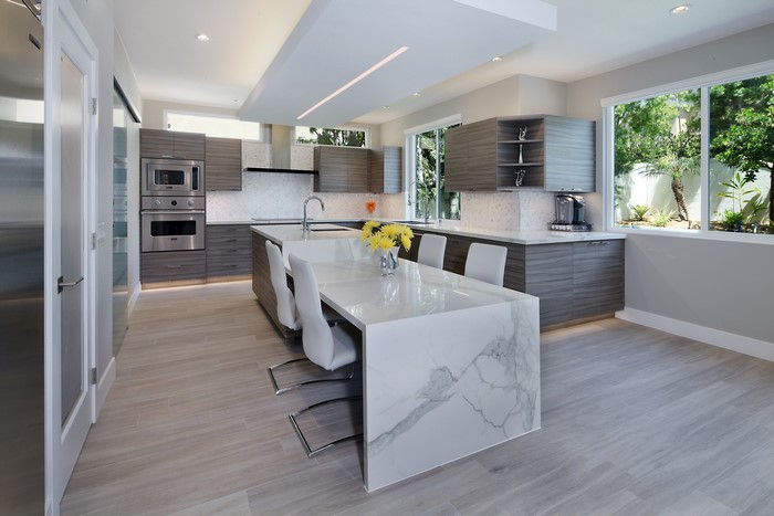 Modern Kitchen with Island and White Chairs