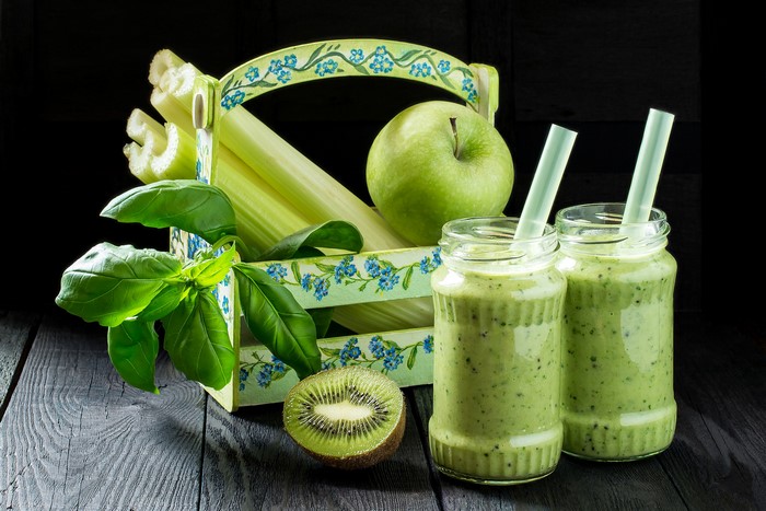 Green smoothies with kiwi, apple, and celery