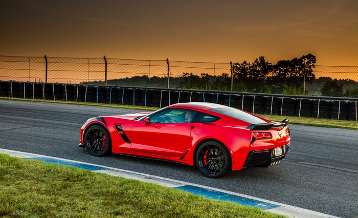 Red Chevrolet Corvette Stingray Coupe C7 on a Racetrack