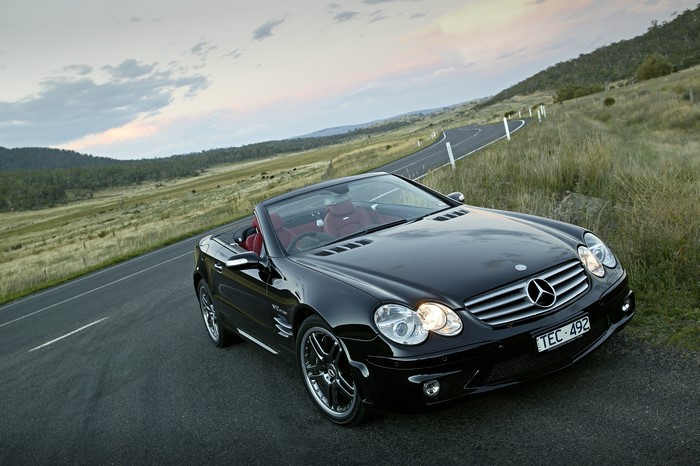 Black Mercedes-Benz SL 65 AMG Cabriolet on a winding road