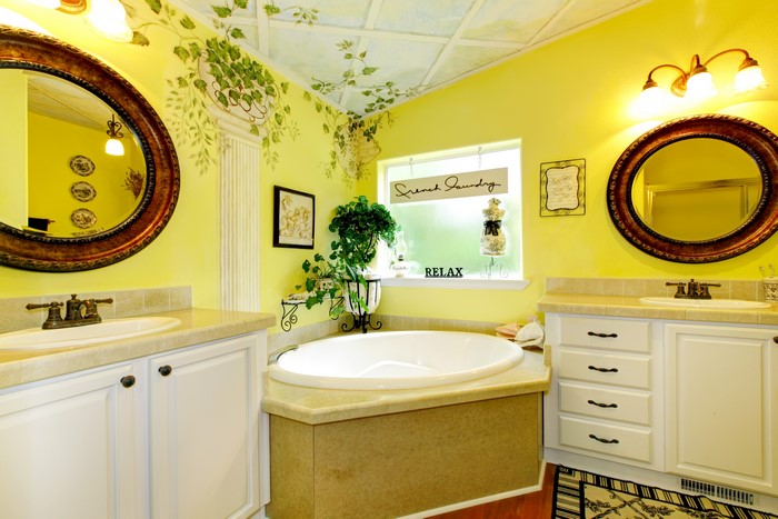 Bathroom with yellow walls and a bathtub
