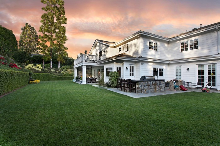Luxury White House with Outdoor Kitchen and Lawn