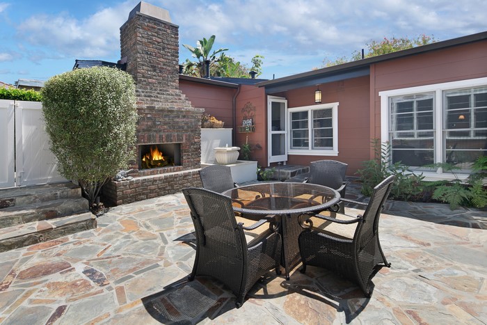 Outdoor Patio with Fireplace and Dining Set