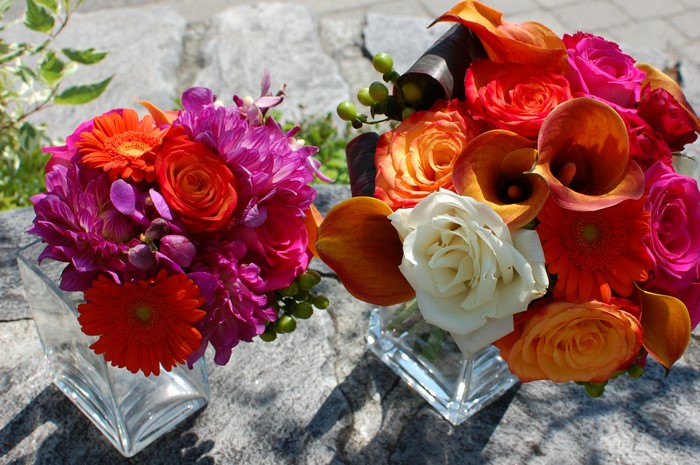 Two bouquets of roses, callas, gerberas, and dahlias
