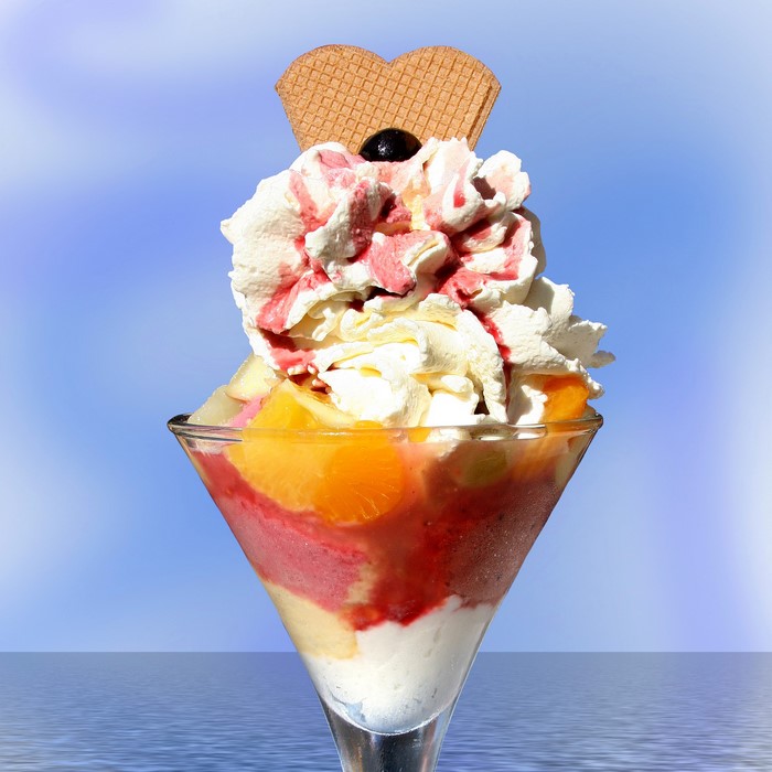 Ice cream sundae with fruit and whipped cream