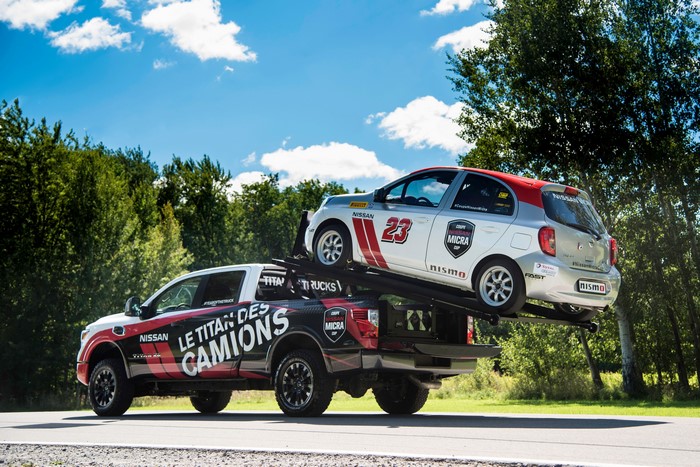 Nissan Titan Trucks carrying Nissan Micra Cup car