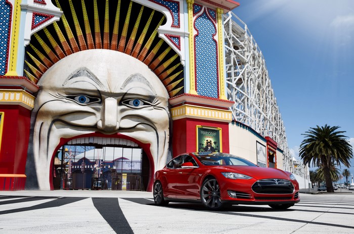 Red Tesla Model S P85 in front of Luna Park entrance