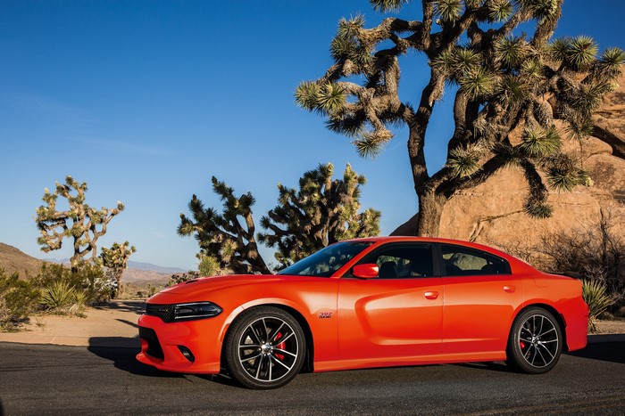 Orange Dodge Charger in a desert landscape
