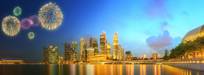 Singapore skyline with fireworks over the river