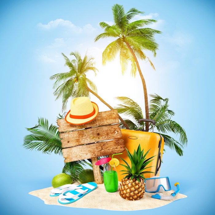 Tropical island vacation with suitcase and pineapple