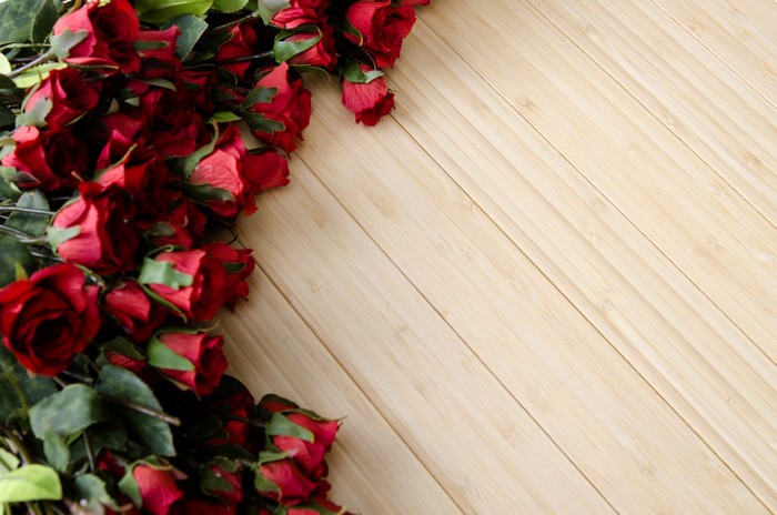 Red Roses on a Wooden Background