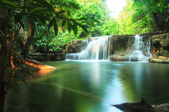 Waterfall in a lush green forest in Thailand