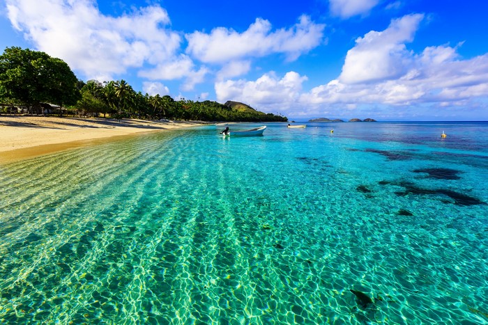 Tropical Beach with Clear Turquoise Water and Boats