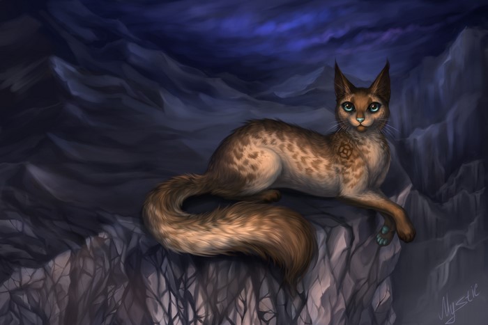 A painted cat with blue eyes rests on a rocky cliff