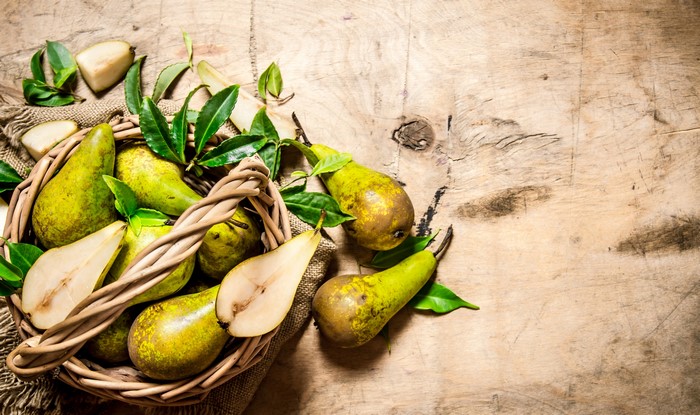 Pears in a Wicker Basket with Foliage
