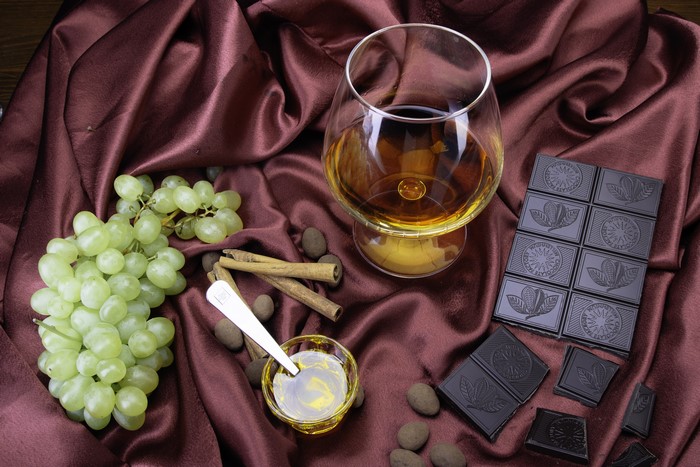 Still-life with Brandy, Grapes, Chocolate, and Cinnamon