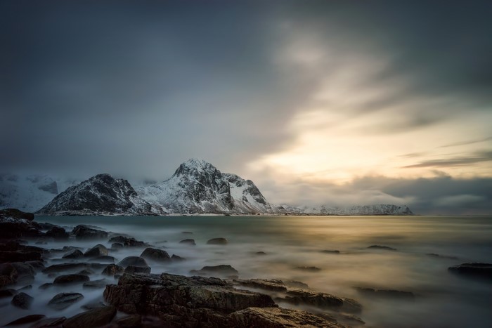 Snowy Mountains and Rocky Shoreline in Lofoten, Norway