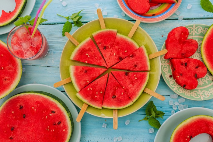 Watermelon slices and hearts on plates