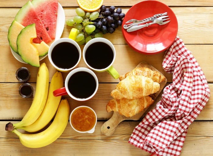 Breakfast with Coffee, Croissants, and Fruit