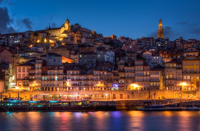 Porto waterfront at night with illuminated buildings and boats