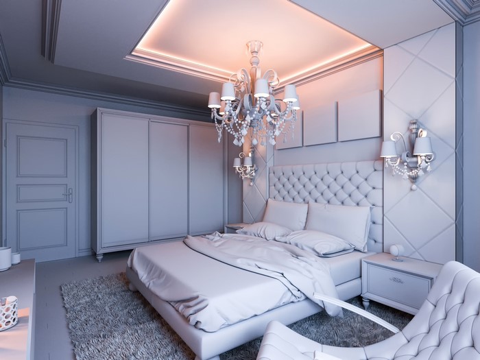 Bedroom interior with bed, chandelier, and wardrobe