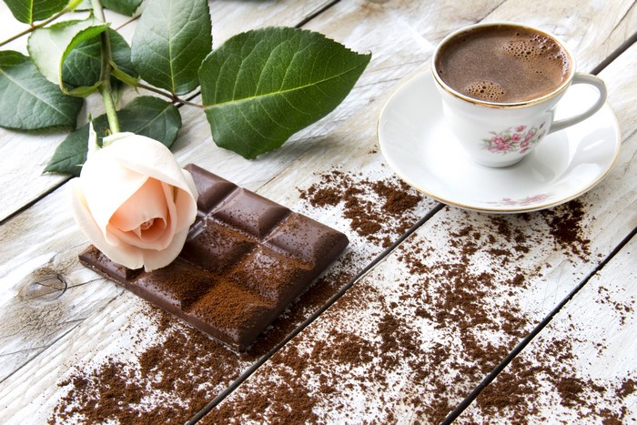 Still-life of coffee, chocolate, and a rose