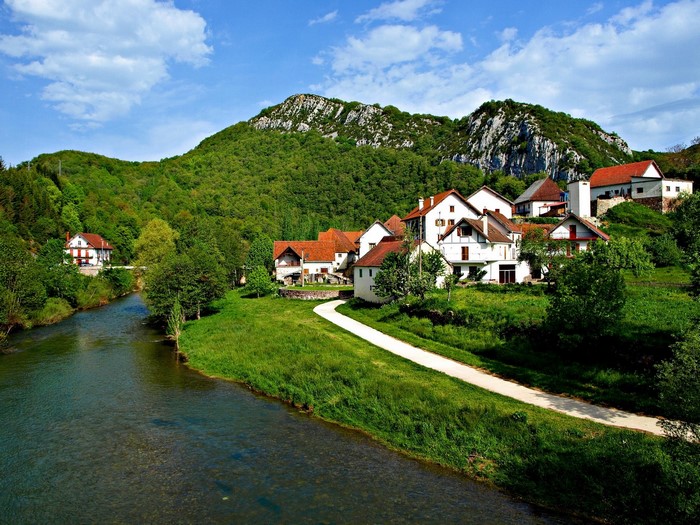 Houses by a river in Salazar Valley, Navarra, Spain