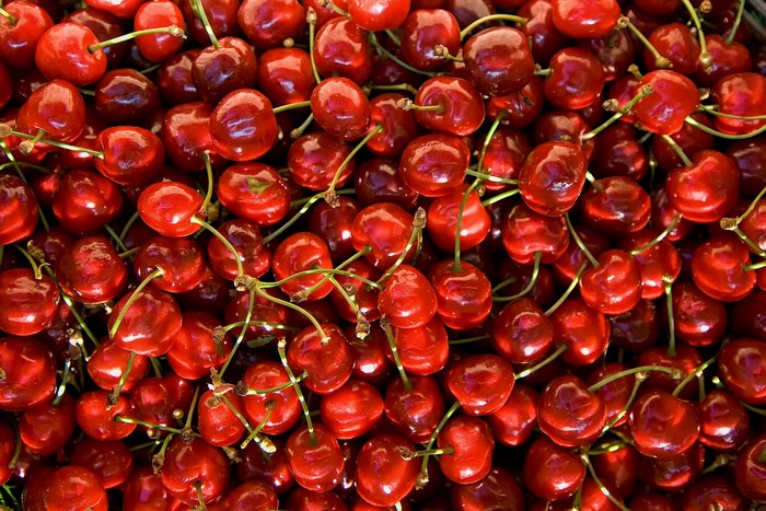 A pile of fresh red cherries
