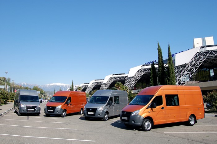 GAZelle Next vans parked in front of a modern building