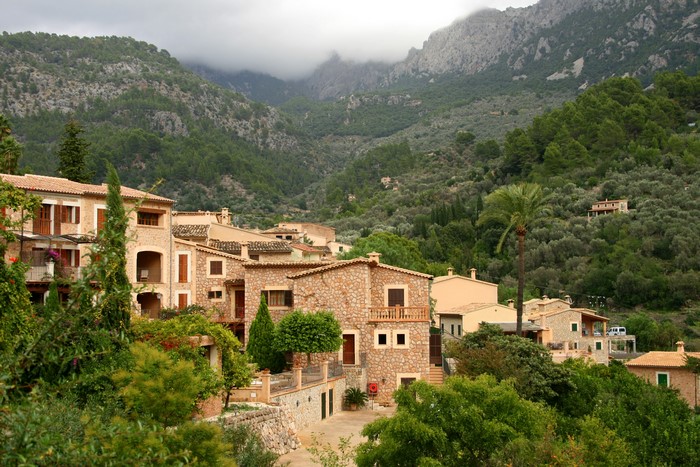 Fornalutx village in Majorca, Spain, with mountains and forests