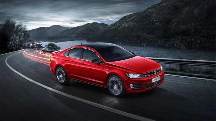 Red 2016 Volkswagen Lamando GTS driving on a winding road