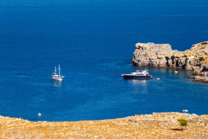 Yacht and sailboat on the sea near Rhodes Island, Greece