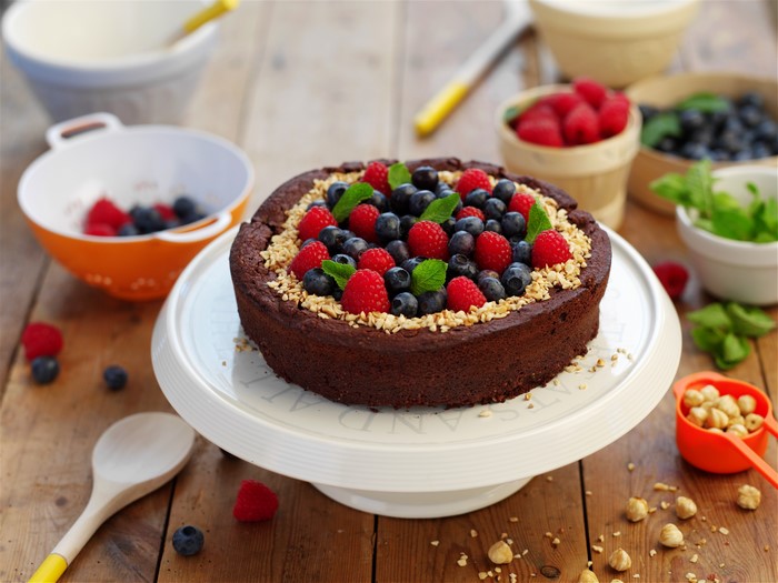 Chocolate cake with berries and nuts