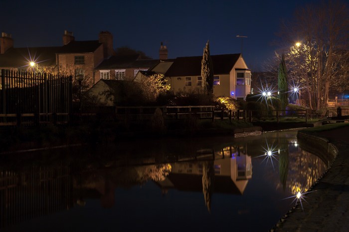 Houses at night by a canal in England