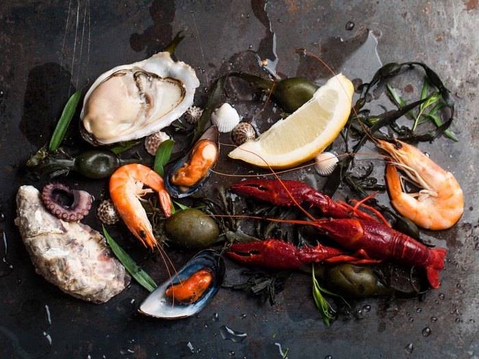 Seafood platter with shrimp, crayfish, oysters, mussels, and lemon