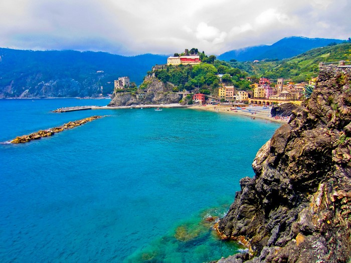 Coastal village with colorful houses and a beach in Italy