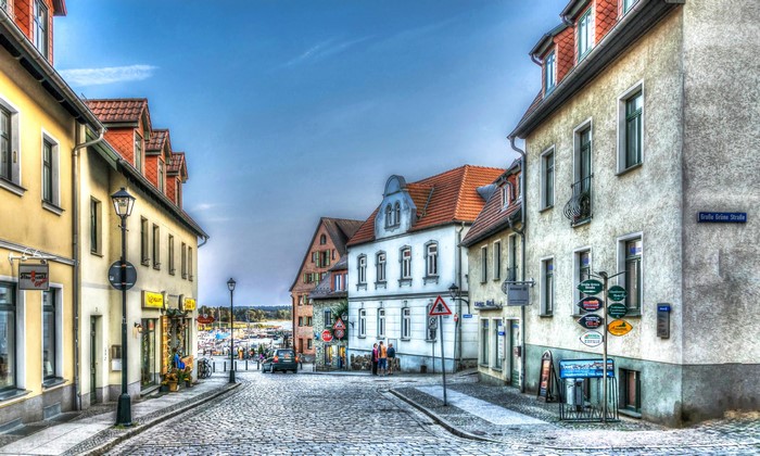 Street in Waren, Germany with historic houses and cobblestone road