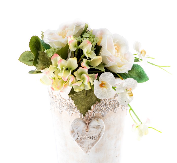 Bouquet of white roses and orchids in a decorative vase
