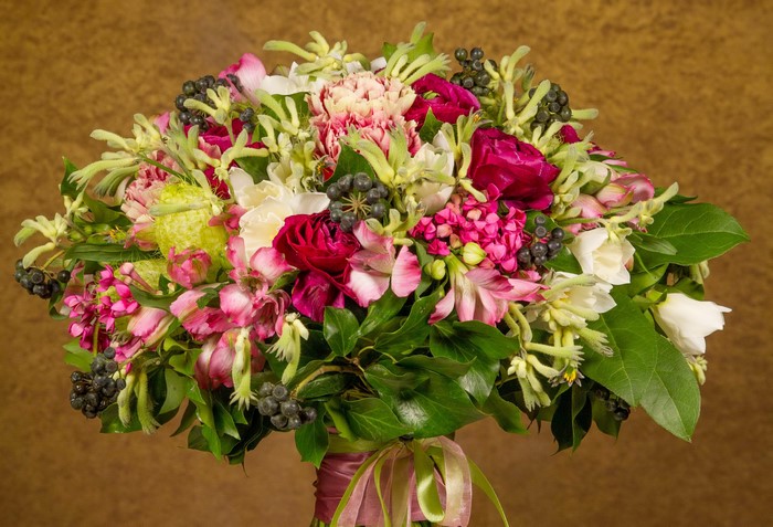A vibrant bouquet of roses and alstroemeria