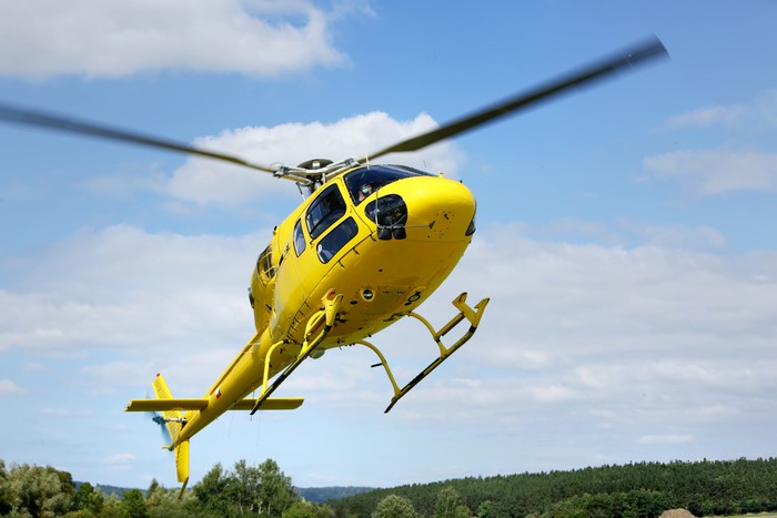 Yellow Helicopter in Flight