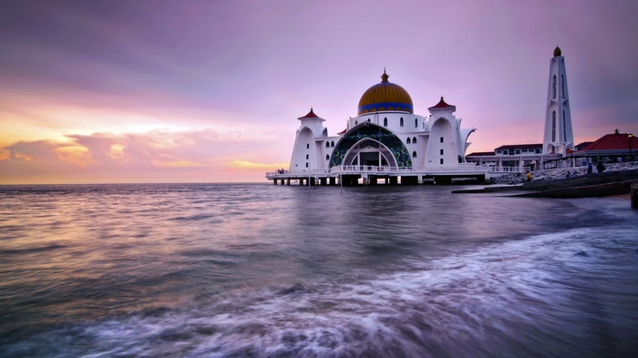 Strait Mosque on the water at sunset