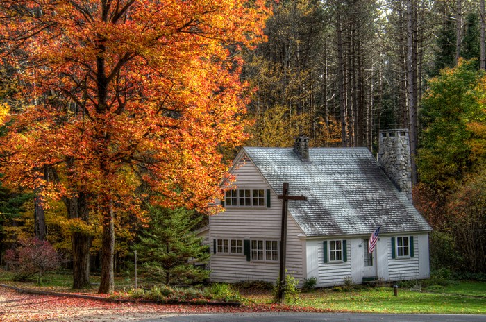 White house with autumn trees in Lanesboro Marshfield, USA